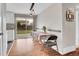 Cozy dining area features hardwood floors and an adjacent door to the back yard at 8353 Adams Way, Denver, CO 80221