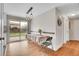 Eat-in kitchen features a table, modern lighting, and sliding door access to the backyard at 8353 Adams Way, Denver, CO 80221