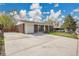 Charming single-story brick home featuring a large driveway and attached one car garage at 8353 Adams Way, Denver, CO 80221