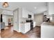 Updated kitchen featuring white cabinets, stainless steel appliances, and tile floors at 8353 Adams Way, Denver, CO 80221