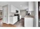 Modern kitchen with white cabinets, stainless steel appliances, and granite countertops at 8353 Adams Way, Denver, CO 80221