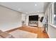 Cozy living room with hardwood floors, recessed lighting, and a modern fireplace at 8353 Adams Way, Denver, CO 80221