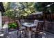 Backyard with a patio area, fire pit table, and comfortable seating at 3812 W 24Th Ave, Denver, CO 80211
