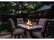 Backyard patio with a fire pit table, providing a cozy outdoor gathering space at 3812 W 24Th Ave, Denver, CO 80211
