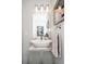 Modern bathroom features a sleek vessel sink, chrome fixtures, and an illuminated vanity mirror at 3812 W 24Th Ave, Denver, CO 80211