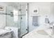 Luxurious bathroom with a glass-enclosed shower, marble accents, and double sinks at 3812 W 24Th Ave, Denver, CO 80211