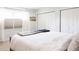 Comfortable bedroom features a large bed, soft lighting, and ample closet space at 3812 W 24Th Ave, Denver, CO 80211
