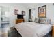 Charming bedroom featuring a comfortable bed, side tables, and view to an ensuite bathroom at 3812 W 24Th Ave, Denver, CO 80211