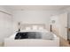 Bright bedroom featuring a cozy bed with stylish decor and an open doorway, creating a welcoming atmosphere at 3812 W 24Th Ave, Denver, CO 80211