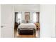 Inviting bedroom features a comfortable bed, stylish decor, and natural light from the windows at 3812 W 24Th Ave, Denver, CO 80211