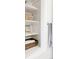 Organized closet with shelves holding towels and baskets, showcasing storage solutions in the home at 3812 W 24Th Ave, Denver, CO 80211