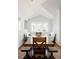 Cozy dining area with a wooden table and bench seating, complemented by bay window at 3812 W 24Th Ave, Denver, CO 80211