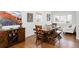 Bright dining room with hardwood floors, a large table, and natural lighting at 3812 W 24Th Ave, Denver, CO 80211