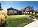 Charming single-story brick home featuring a well-manicured lawn and beautiful landscaping at 3812 W 24Th Ave, Denver, CO 80211