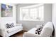 Bright living space featuring white sofas and bay windows, creating a cozy and inviting atmosphere at 3812 W 24Th Ave, Denver, CO 80211
