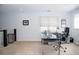 Bright office space featuring a large window, sleek desk, and comfortable office chair at 3812 W 24Th Ave, Denver, CO 80211