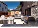 Entertain in this backyard with a built-in stainless steel outdoor kitchen and a cozy seating area at 3812 W 24Th Ave, Denver, CO 80211