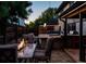 Enjoy cool evenings gathered around the fire pit near the outdoor kitchen and hot tub at 3812 W 24Th Ave, Denver, CO 80211
