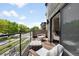 Outdoor balcony area with seating, great views and a sleek railing at 417 N Madison St, Denver, CO 80206