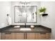 Bathroom with a modern sink, vanity, sleek fixtures, and a mirror reflecting the walk-in shower at 417 N Madison St, Denver, CO 80206