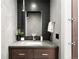 Elegant bathroom featuring a sleek vanity, modern fixtures, and a stylish tiled wall at 417 N Madison St, Denver, CO 80206