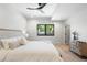 Relaxing bedroom with a ceiling fan, neutral tones, and a window offering a view of the neighborhood at 417 N Madison St, Denver, CO 80206