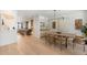 Open-concept dining area with wood table, chairs, and views of the kitchen at 417 N Madison St, Denver, CO 80206