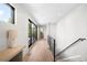 Bright hallway with natural light, wood floors, and modern staircase at 417 N Madison St, Denver, CO 80206