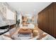 Spacious living room with modern fireplace, lots of natural light and an open layout into the modern kitchen at 417 N Madison St, Denver, CO 80206