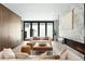 Bright living room featuring a modern fireplace and open plan design with stylish furniture and hardwood floors at 417 N Madison St, Denver, CO 80206