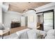 Bright primary bedroom with vaulted ceilings, a seating area, and an ensuite bathroom at 417 N Madison St, Denver, CO 80206