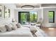 Bright main bedroom with a king bed, decorative rug, and balcony access at 417 N Madison St, Denver, CO 80206