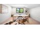Bright home office with a large window, a stylish desk, and a cozy seating area at 417 N Madison St, Denver, CO 80206