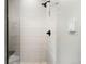 Close-up of a modern shower with a sleek shower head, a tile accent wall, and modern fixtures at 417 N Madison St, Denver, CO 80206