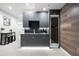Finished basement with a wet bar, modern cabinets, and a wine refrigerator at 417 N Madison St, Denver, CO 80206