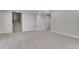 A bright basement with light gray carpet and plenty of room for customization at 6863 Oak Canyon Cir, Castle Pines, CO 80108