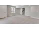 Large basement with light gray walls and carpeted floors, great for entertaining at 6863 Oak Canyon Cir, Castle Pines, CO 80108