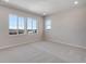 Bedroom with large windows and neutral carpet, with ample space at 6863 Oak Canyon Cir, Castle Pines, CO 80108
