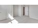 A bedroom featuring neutral carpet, light gray walls and closet with double doors at 6863 Oak Canyon Cir, Castle Pines, CO 80108