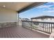 A partially covered deck with views of the neighborhood at 6863 Oak Canyon Cir, Castle Pines, CO 80108