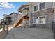 Exterior view of home showing patio, siding, and stairs to upper level deck at 6863 Oak Canyon Cir, Castle Pines, CO 80108