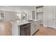 Open kitchen view featuring a large island with stainless steel appliances and barstool seating at 6863 Oak Canyon Cir, Castle Pines, CO 80108