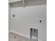 Spacious laundry room with tile floor and hookups for a washer and dryer at 6863 Oak Canyon Cir, Castle Pines, CO 80108