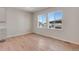 Bright living room with hardwood floors and large windows at 6863 Oak Canyon Cir, Castle Pines, CO 80108