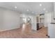 An open layout with bright rooms, light wood floors, and modern staircase at 6863 Oak Canyon Cir, Castle Pines, CO 80108