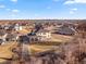 Aerial view of a neighborhood and homes with lake views, perfect for outdoor activities at 15 Latigo Pl, Littleton, CO 80123