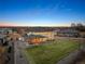 A twilight aerial view showcasing a large backyard, covered patio, and neighborhood at 15 Latigo Pl, Littleton, CO 80123