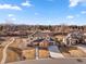 Stunning aerial view of the home showcasing its landscape, curb appeal, and mountain views at 15 Latigo Pl, Littleton, CO 80123