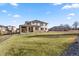 Expansive backyard with a covered patio, perfect for outdoor living and entertaining at 15 Latigo Pl, Littleton, CO 80123