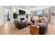Living room with hardwood floors, fireplace, and lots of natural light makes an inviting space to gather at 15 Latigo Pl, Littleton, CO 80123